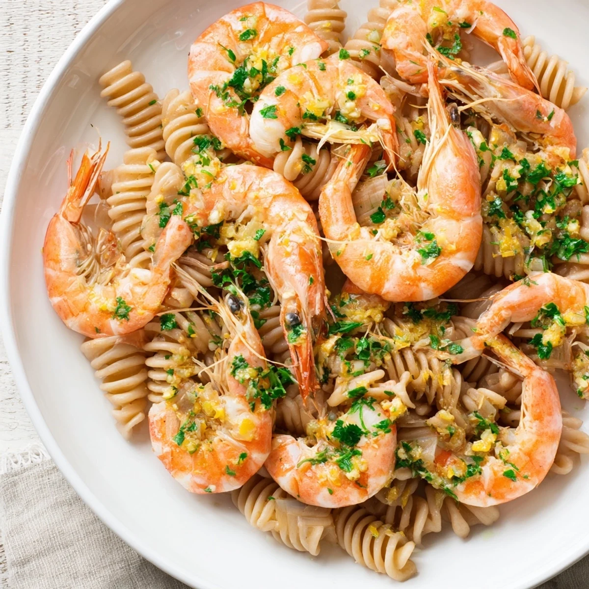 Bright, flavorful Light & Bright Lemon Herb Shrimp Scampi, beautifully plated and ready to enjoy with a tangy sauce.