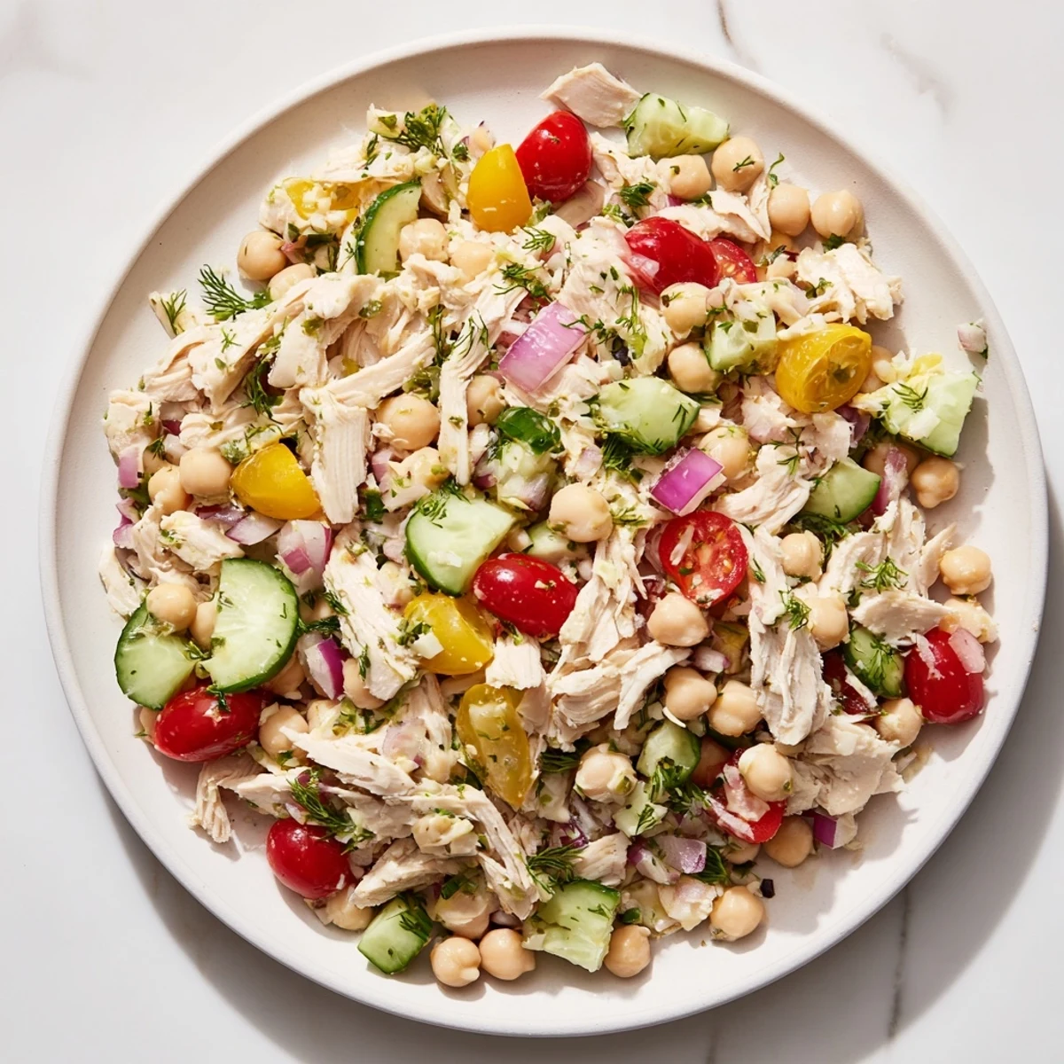 A close-up of the flavorful dense bean salad with lemon-dill chicken, ready to serve and enjoy.