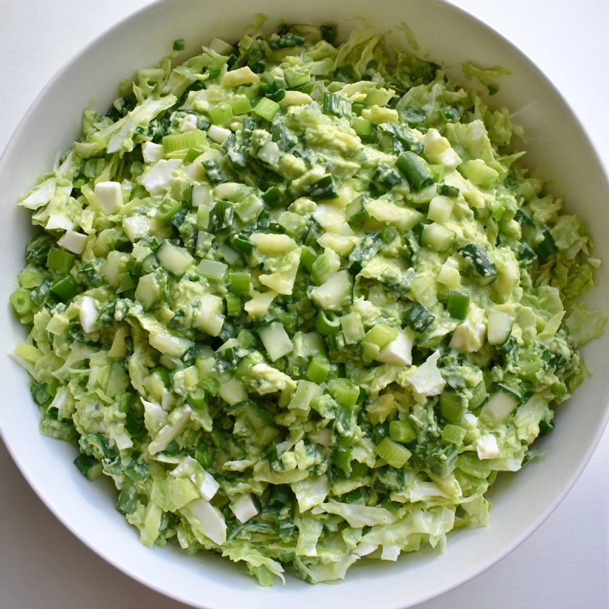 This Green Goddess Cabbage Dip recipe shows off a refreshing side with crunchy, chopped vegetables tossed in dressing.