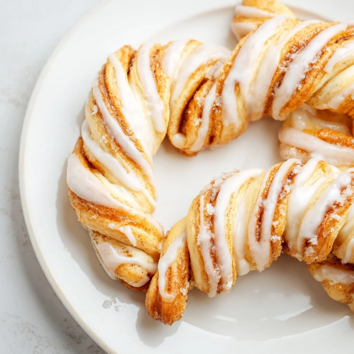 Air-fryer cinnamon roll twists, warm and glazed, are an amazing quick breakfast ready in under 20 minutes.