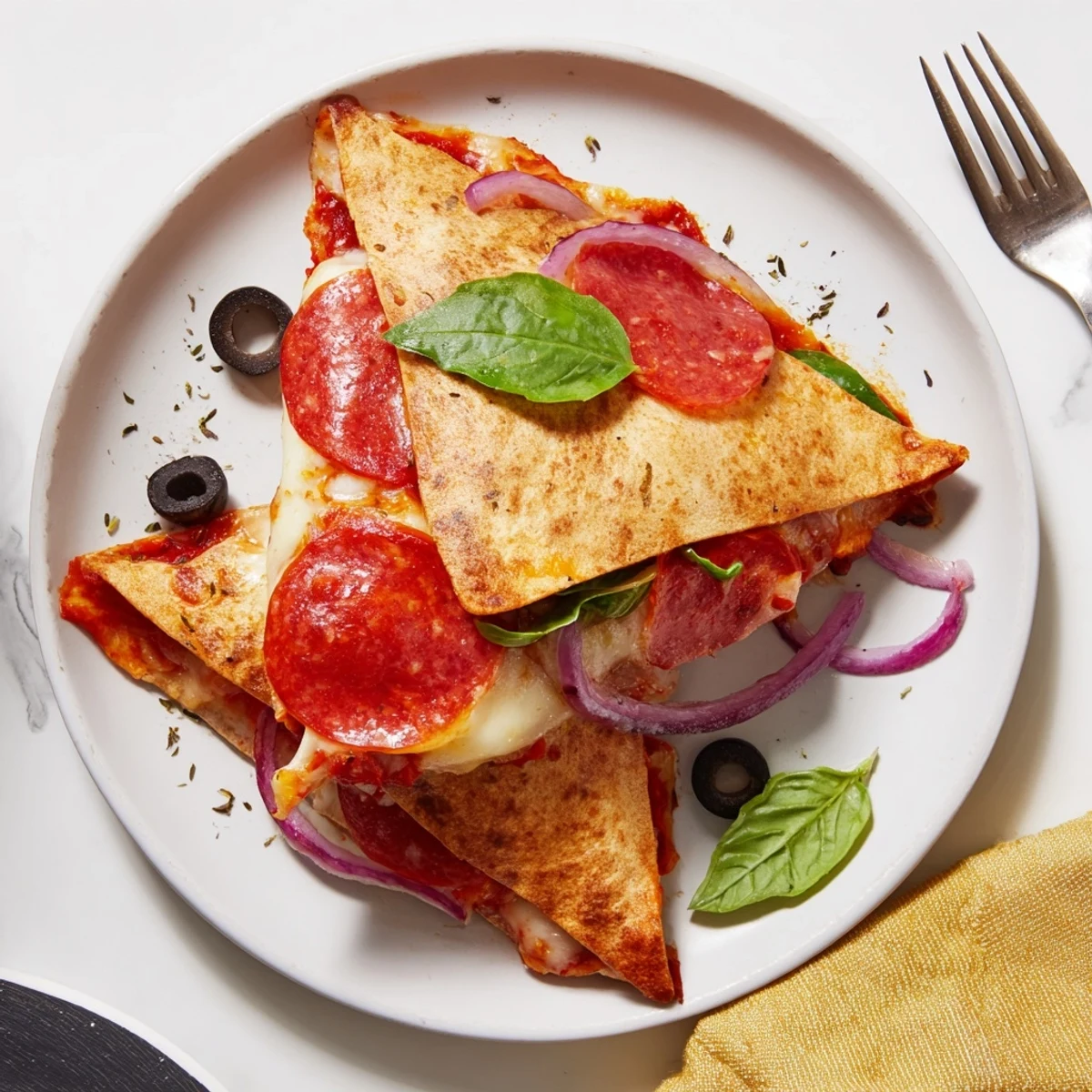 Golden-brown, crispy tortilla pizza wrap loaded with melted mozzarella, pepperoni, and fresh veggies, served hot from the skillet.