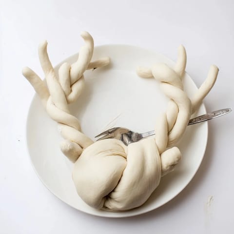 Warm, cheesy Spinach Dip filling the Reindeer Antler bread, perfect party food for sharing.