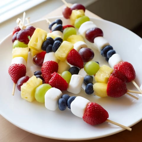 Vibrant Christmas Light Fruit Skewers offer a healthy, colorful appetizer for any holiday party.