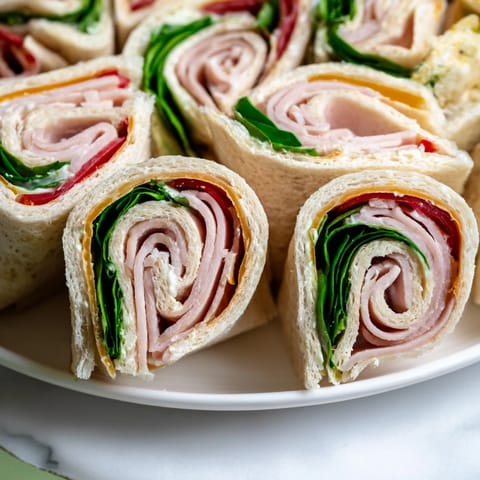 Festive star-shaped party sandwiches ready to serve, filled with vibrant ingredients.