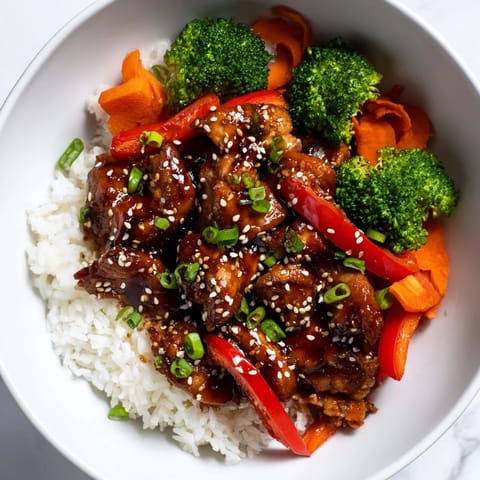 Meal-prepped Teriyaki Chicken Rice portioned in containers, perfect for a balanced, delicious lunch.