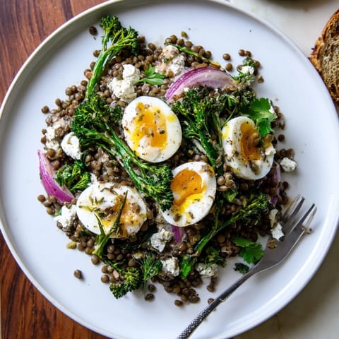 Tender French lentils and crisp broccolini topped with jammy soft-cooked eggs for a hearty, vegetarian main dish.