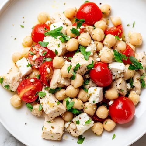 Mediterranean Chickpea Chicken Salad tossed with Kalamata olives and fresh parsley, served as a refreshing lunch.