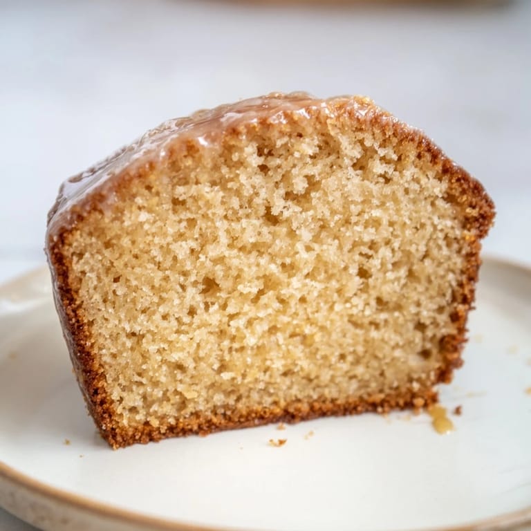 Picture this: baked Soft Glow Golden Honey Pound Cake glistening, with a golden crumb, inviting you to enjoy.