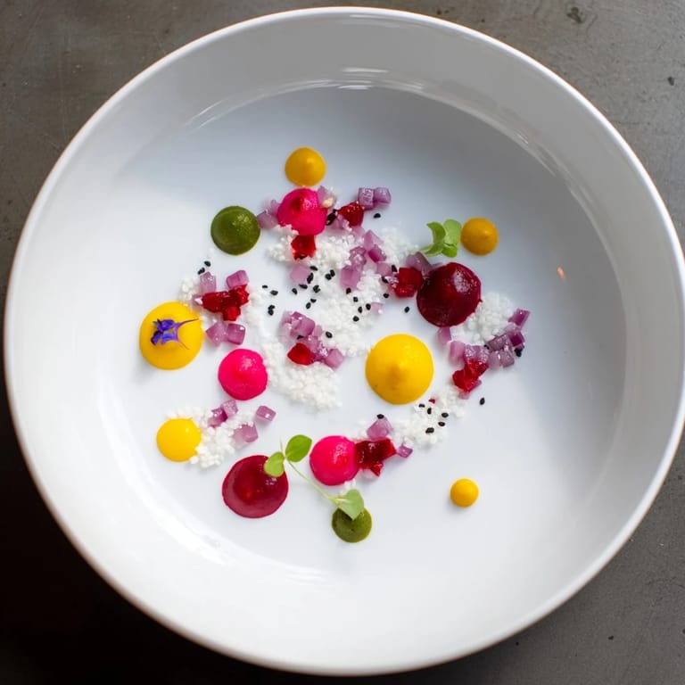 A beautifully arranged Pointillism Dot Matrix dish featuring bright vegetable dots, ready to eat.