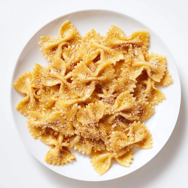 Bowtie pasta transformed into sweet and savory Air Fryer Pasta Christmas Crack, perfect for snacking.