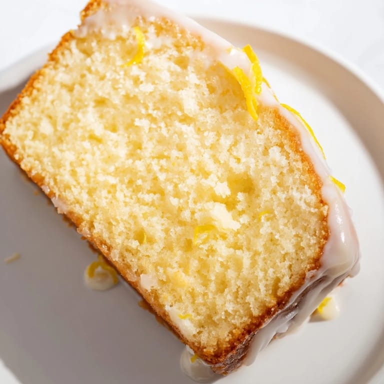 Homemade Lemon Yogurt Cake, showing a moist interior with a hint of lemon, made easily.