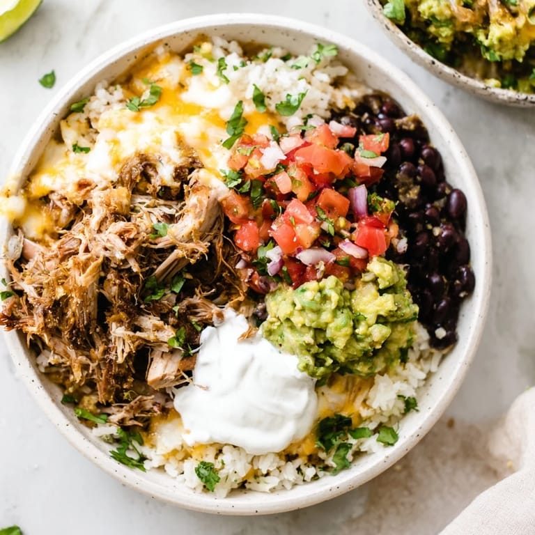 This Chipotle Burrito Bowl Copycat features layers of vibrant ingredients: rice, beans, and fresh toppings.
