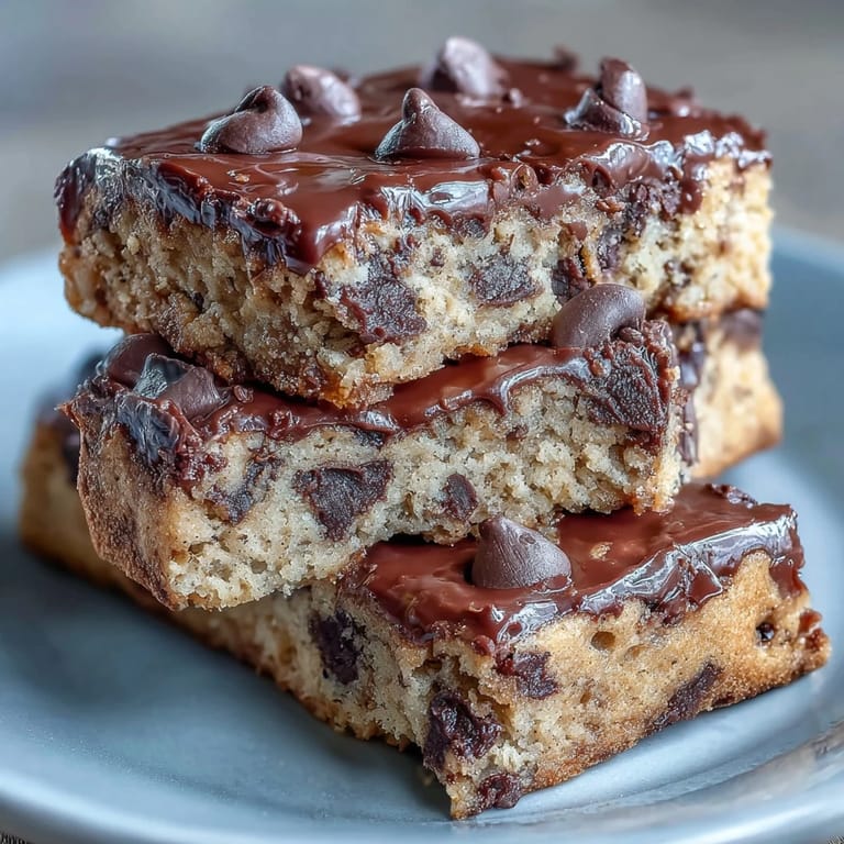 Soft, chewy protein bars packed with almond flour and vanilla protein powder, topped with dark chocolate chips.